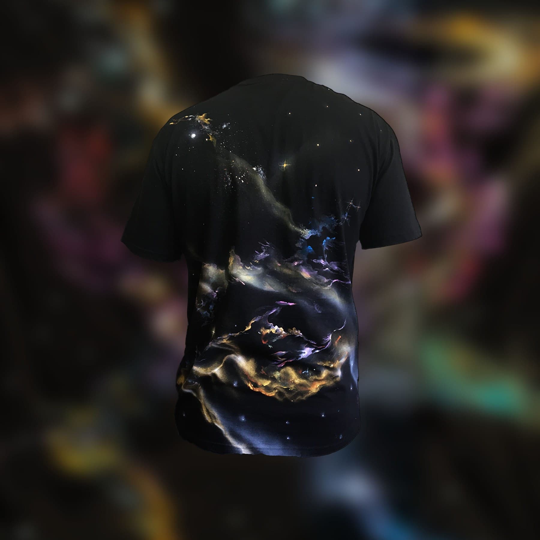 Back view of a black Galaxy T-shirt with swirling nebulae and stars.