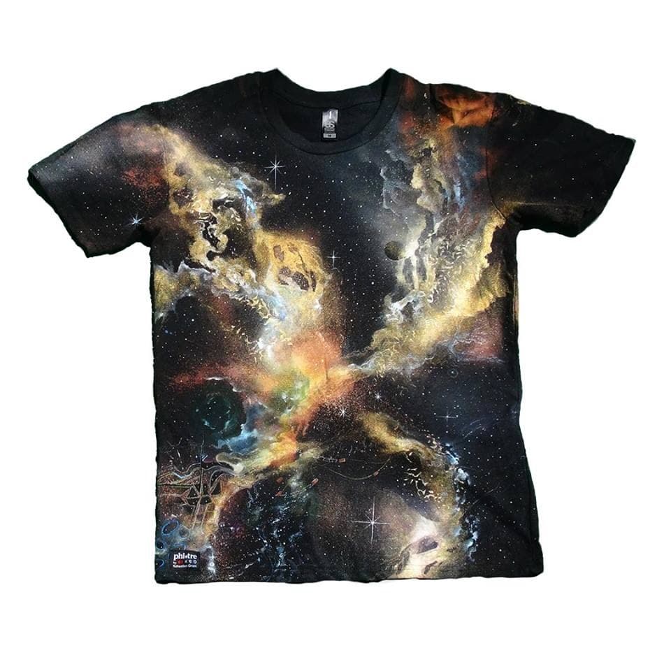 Black Phi Tre T-shirt painted with golden nebulae, blue highlights and white stars.